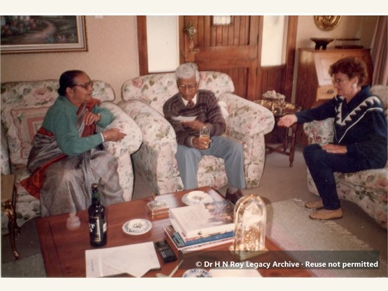 Dr H N Roy and wife having a friend over for lunch in South Africa