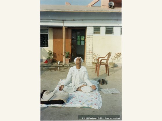 Dr H N Roy at home doing yoga