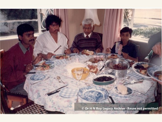Dr H N Roy having lunch with family and friends in South Africa