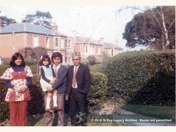 Dr H N Roy with son daughter and neighbours kid in England